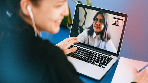 Two remote employees speaking online.